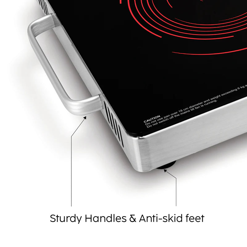 Portable electric stove with sturdy handles and anti-skid feet on a white background