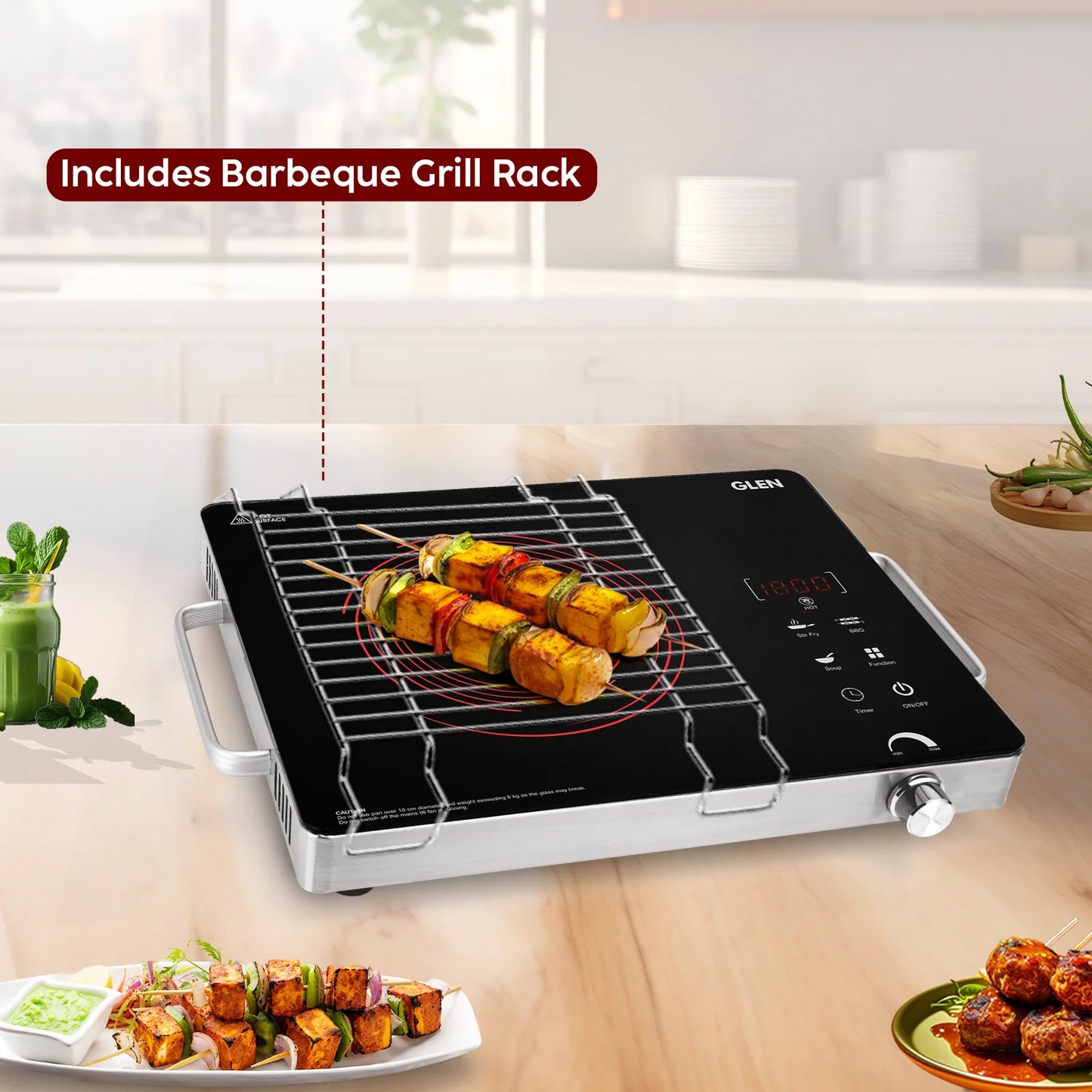 Induction cooktop with barbeque grill rack on a kitchen counter, displaying skewered food.