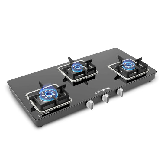 Three-burner gas stove with blue flames on a white background